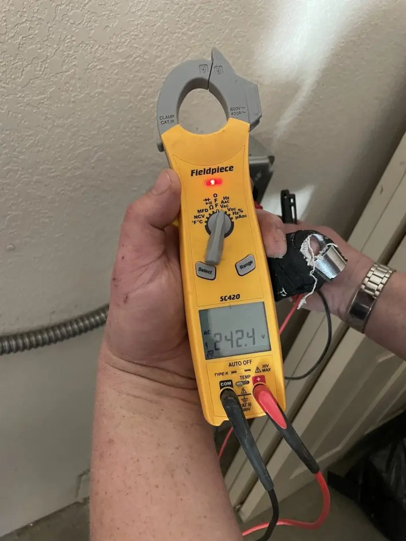 Voltage testing with clamp meter during Ceiling Fan Installation in McComb